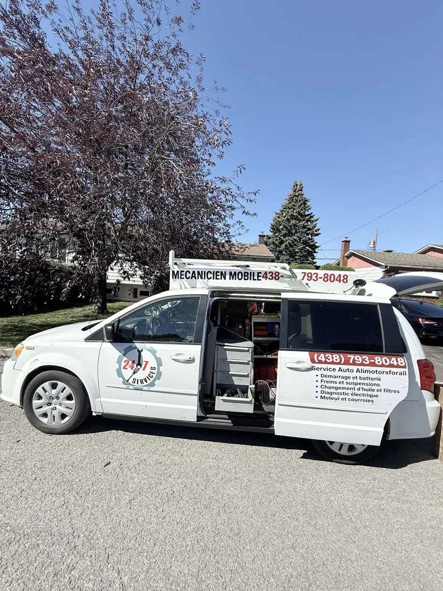 White Alimotorsforall Dodge Grand Caravan with the side door open showing tool drawers