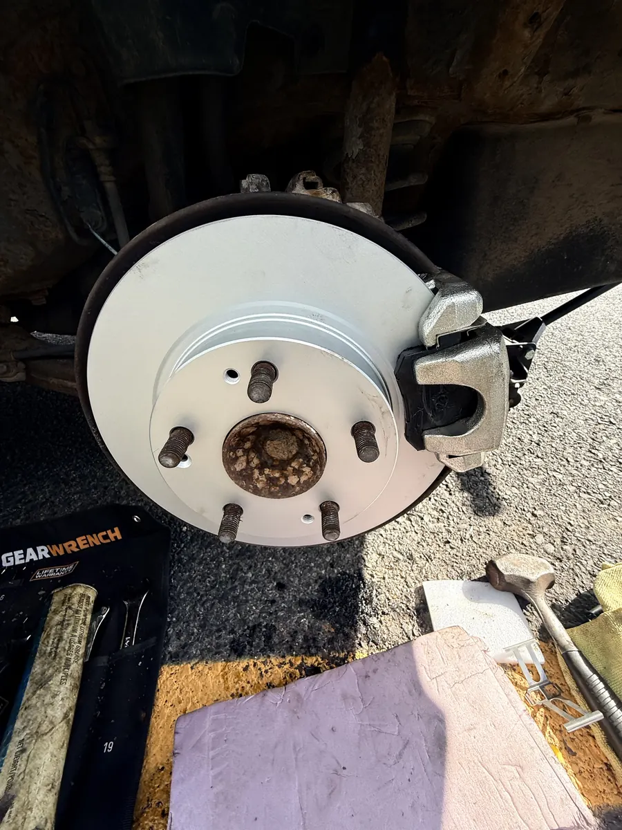 Toyota Corolla: Rotors and pads, done at the curb
